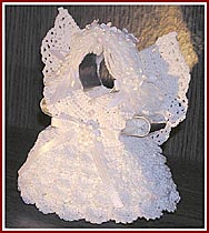 Aunt Irma's Snow Angel is crocheted in white pearlized cotton thread on a cookie cutter base.